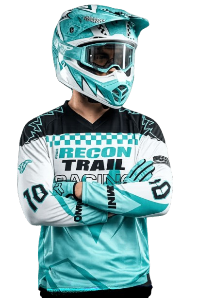 RECON TRAIL Off-Road Rider Off-road rider wearing RECON TRAIL racing gear, helmet, and goggles with arms crossed.